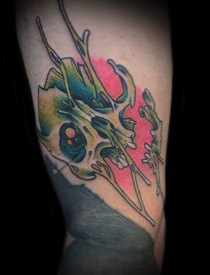 Dripping skull tattoo